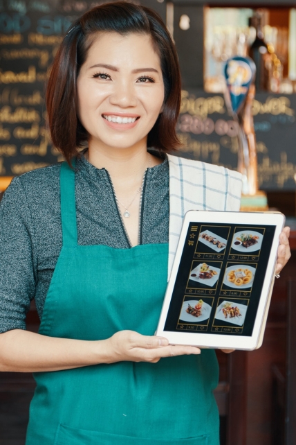 Waitress showing menu